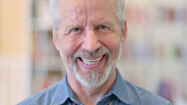 istock Close up of Cheerful Old Man Looking at the Camera 1331453712