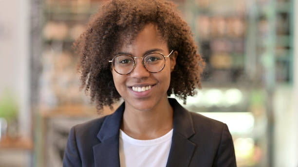 istock Smiling African Businesswoman Looking at Camera 1331453959