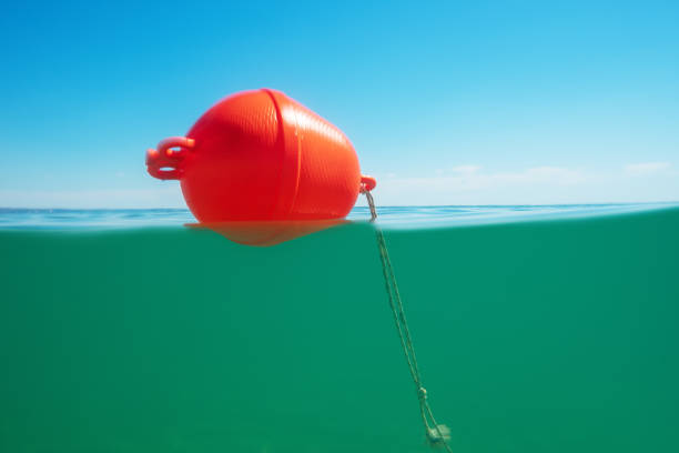 Buoy float on the sea water and underwater view