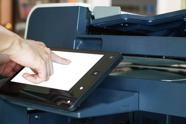 istock Bussiness man Hand press button on panel of printer, printer scanner laser office copy machine supplies start concept. 1331455059