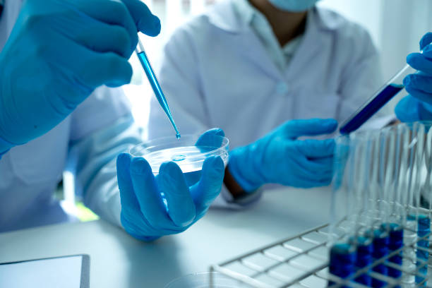 istock Scientists are holding chemical test tubes 1331455948