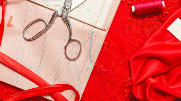 istock Flat lay composition with scissors, pattern and sewing supplies on white background. Space for text 1331457649