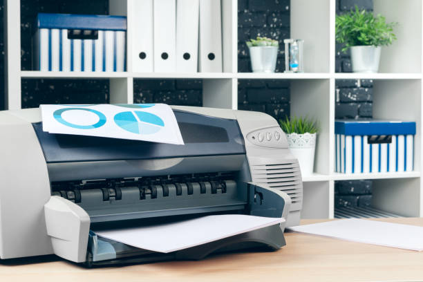 istock Copier or printer in a modern office interior close up 1331458903