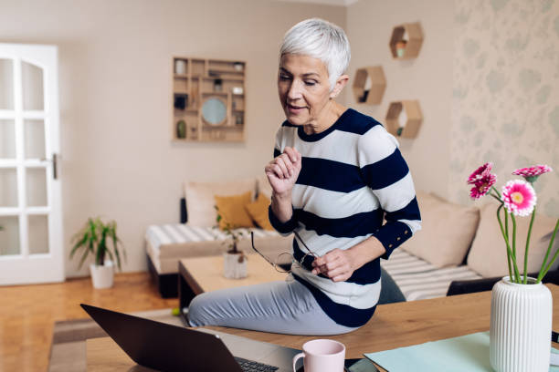 istock Mature woman communicating with her clients online 1331459284