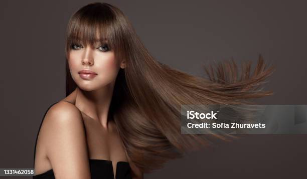 Young Brown Haired Beautiful Model With Long Straight Well Groomed Hair Hair Care And Hairdressing Art Stock Photo - Download Image Now