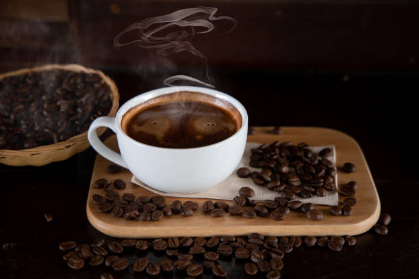 istock Hot coffee cups and coffee beans are placed on a small basket. 1331465301