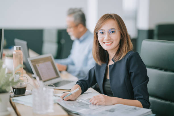 https://media.istockphoto.com/id/1331469730/photo/asian-chinese-woman-looking-at-camera-at-her-place-of-work-smiling-with-confidence.jpg?s=612x612&w=0&k=20&c=oB7P_HNftwSFLYT2EidgBr5Df9FGeW_XylqO5xR5fsE=