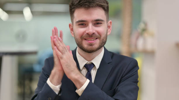 istock Excited Young Businessman Clapping, Cheering 1331469924