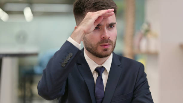 istock Curious Young Businessman Looking for Opportunities 1331469925