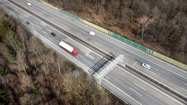 istock Truck toll system on highway - control gantry, aerial view 1331470889