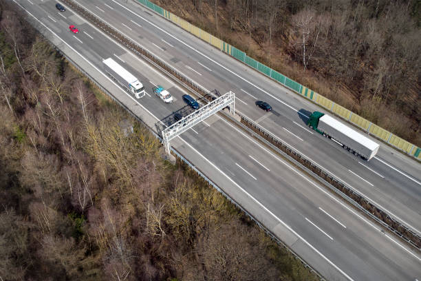 istock Truck toll system on highway - control gantry, aerial view 1331470898