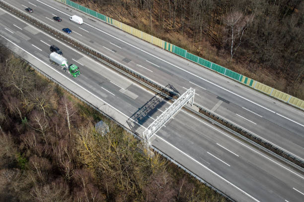 istock Truck toll system on highway - control gantry, aerial view 1331470914