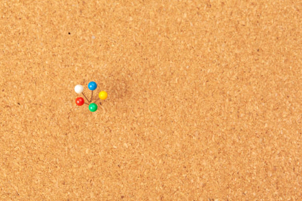 istock Group of thumbtacks pinned on corkboard 1331472390