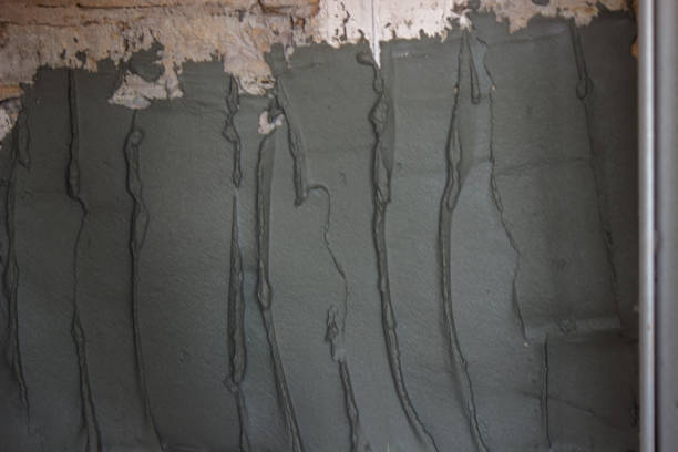 istock man plastering the wall. Construction, repairs in the house. 1331472709