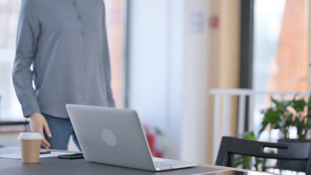 istock Young Latin Woman Coming Back to Work on Laptop 1331473719
