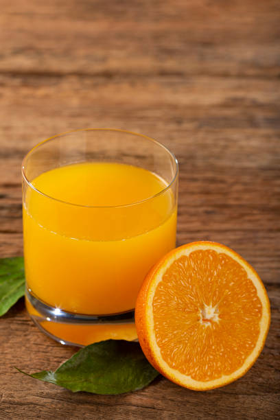 istock Glass with orange juice on the table. 1331476767