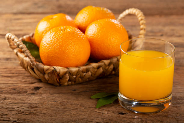 istock Glass with orange juice on the table. 1331476777
