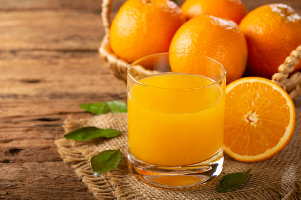 istock Glass with orange juice on the table. 1331476805