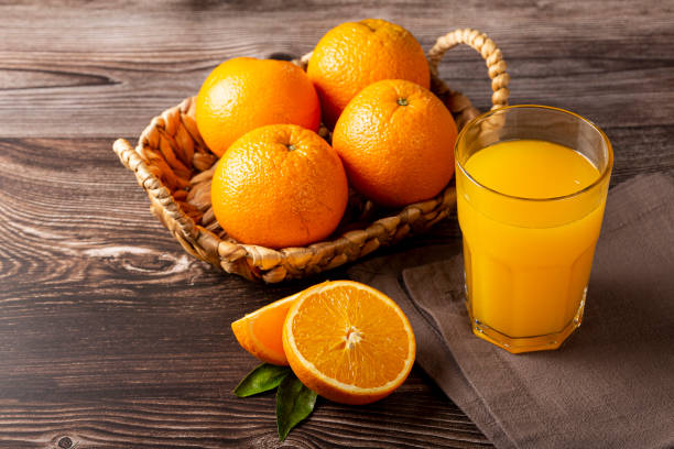 istock Glass with orange juice on the table. 1331476952