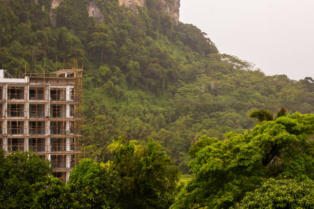 abandoned hotel old in scaffolding against the background of green mountains - 11275 imagens e fotografias de stock