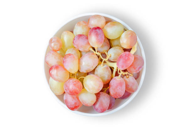 istock Grape. Ripe berries in a white plate. Isolated on white 1331480756