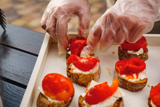 istock catering work. pickled vegetables are placed on bruschetta with butter. 1331481378