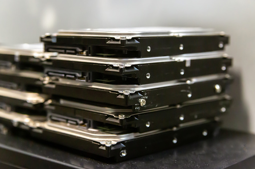 stack of hard drives for data storage data center close-up