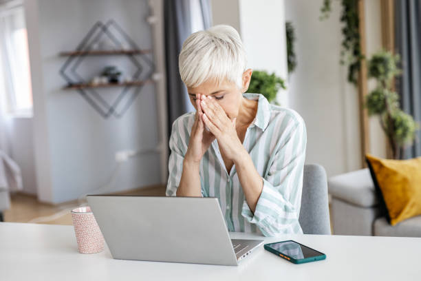 istock Mature woman working on the laptop and feeling stressed 1331483601