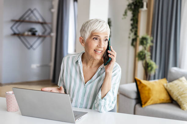 istock Mature woman at home  working 1331483790