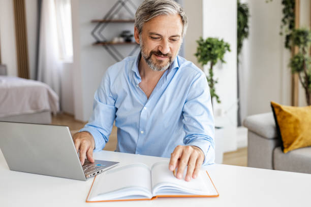 istock Mature man working on the laptop 1331484515