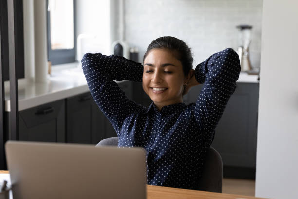 istock Happy relaxed employee working at computer from home 1331487038