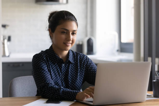 istock Happy Indian student girl studying online, using laptop 1331487056