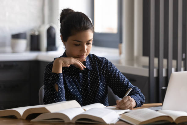 istock Focused millennial Indian student girl studying from home 1331487102