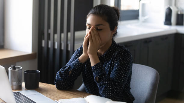 Tired overworked Indian employee feeling fatigue and burnout