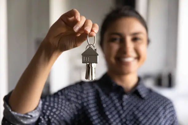 Photo of Happy Indian woman ready to move into new home