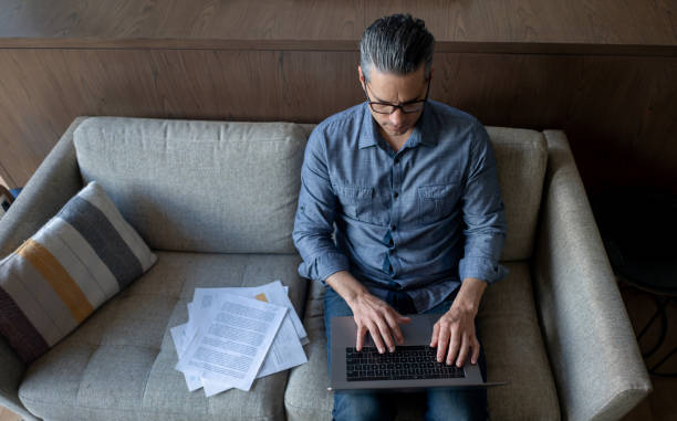 istock Business man working at home on his laptop computer 1331490701