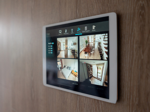 Home security system using cameras to monitor the different rooms of the house - smart home concepts. **DESIGN ON SCREEN WAS MADE FROM SCRATCH BY US**