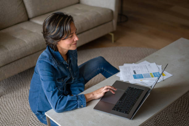 istock Happy woman looking very comfortable working at her home office 1331490767