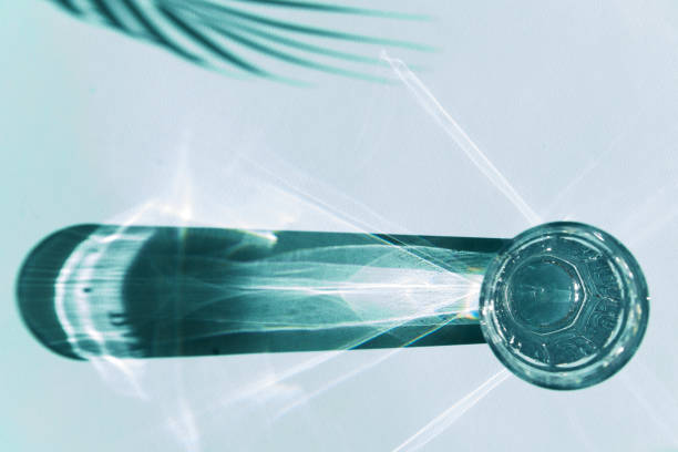 Glass of drinking water with a splash coming out of the top.