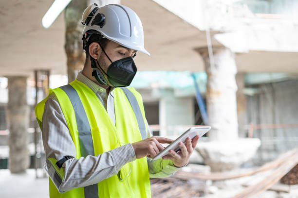 istock 30-year-old male engineer is in the middle of work, reviewing documents from his electronic tablet 1331494998