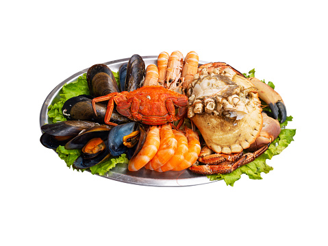 Seafood serving isolated on white. Mussels, shrimps, brown crab, spider crab and Norway lobsters
