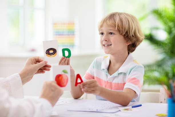 Kid learning to read. Phonics flash cards. stock photo