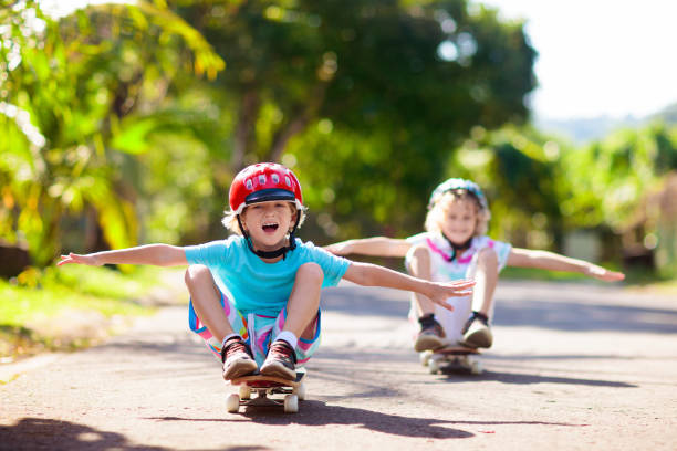 istock Kid with skateboard. Child riding skate board. 1331498511