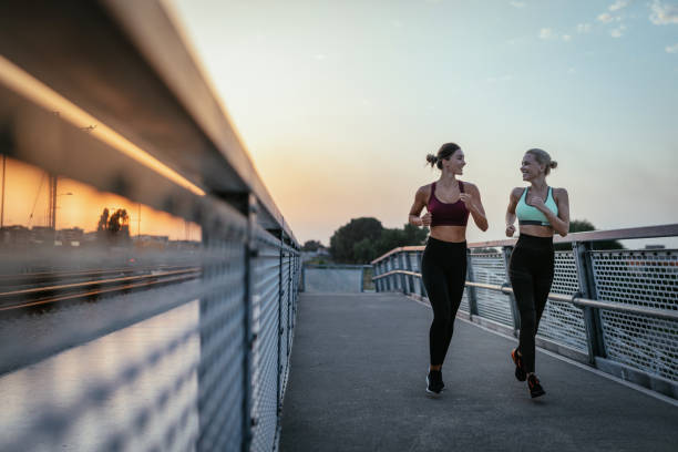 istock Women exercising together outdoors in summer evening 1331499399