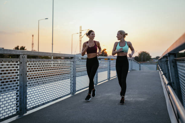 istock Women exercising together outdoors in summer evening 1331499456