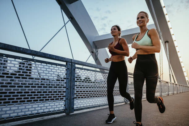 istock Two diverse women exercising together outdoors in summer evening 1331499480