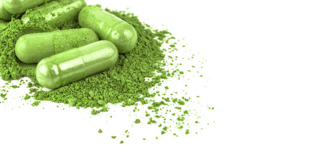 istock andrographis herb capsule on white for banner background, andrographolide herbal capsule green powder for banner, paniculata pill capsule herb and copy space 1331500687