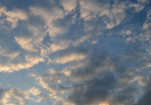 istock Cirdle gray-white clouds in the rays of sunset . 1331505467