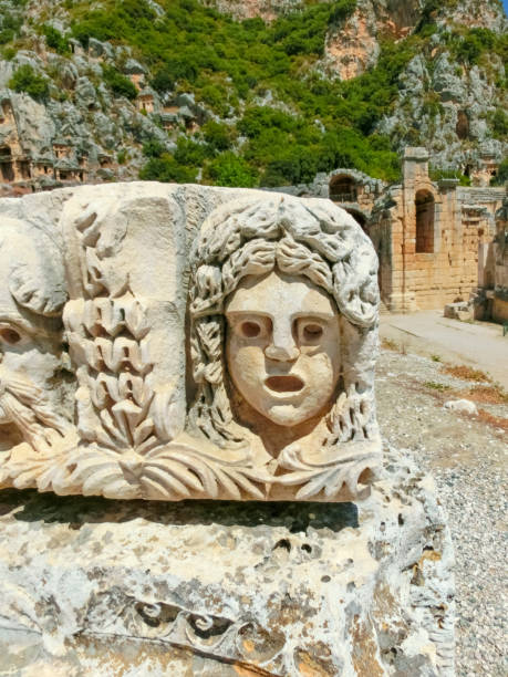 istock Masks and rock tombs in Myra, Turkey 1331505739