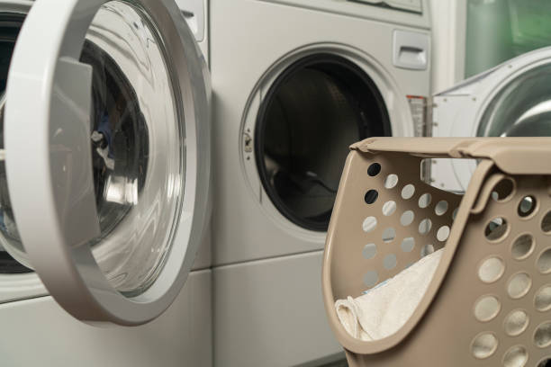 istock Close up view of a laundry baskets and an opened washer 1331506520